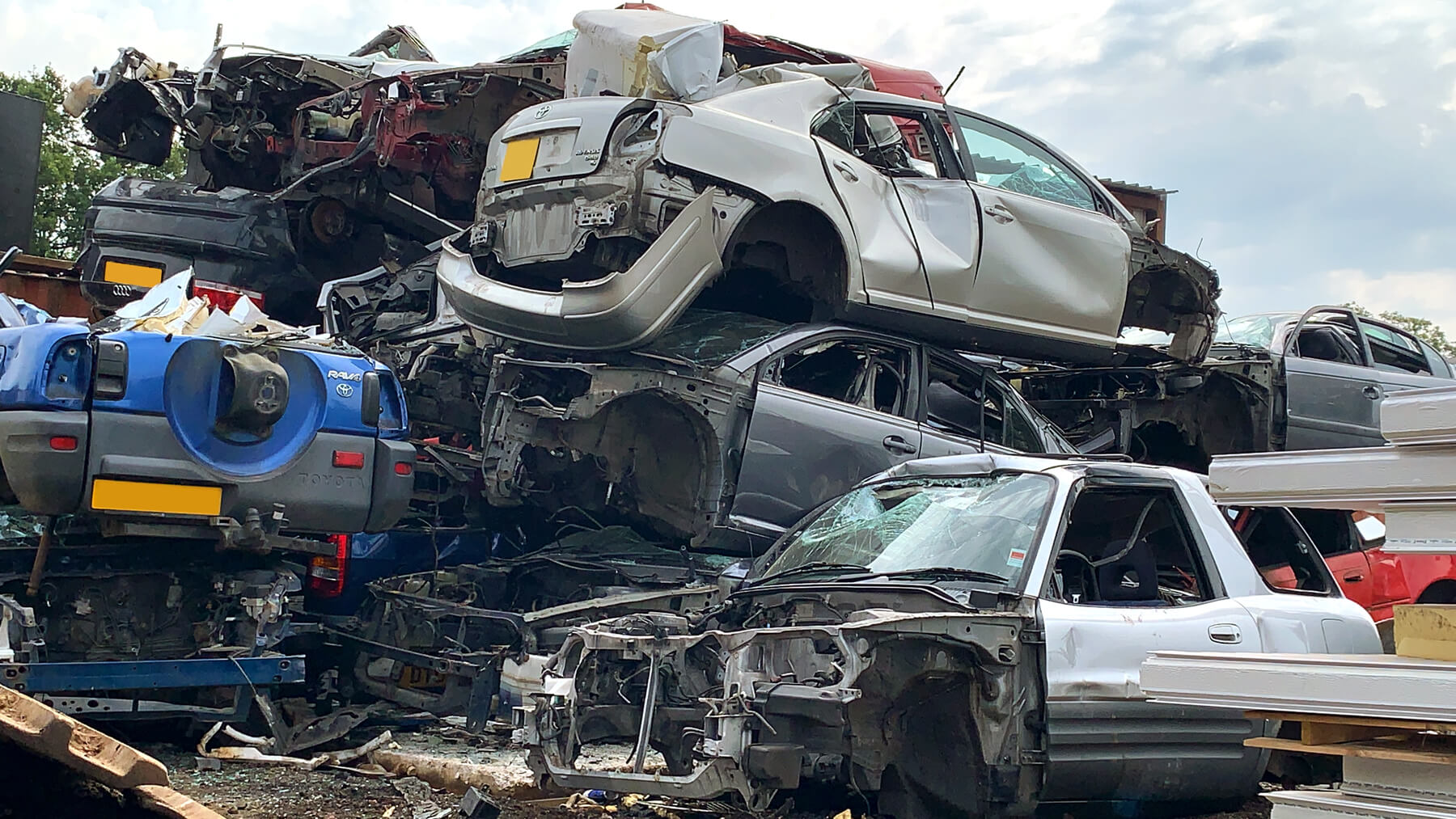 Scrap Cars ready to go in the best scrap metal trailer the Luck Tipping Trailer for Scrap Cars or the Luck Steel body walking floor for scrap car transport